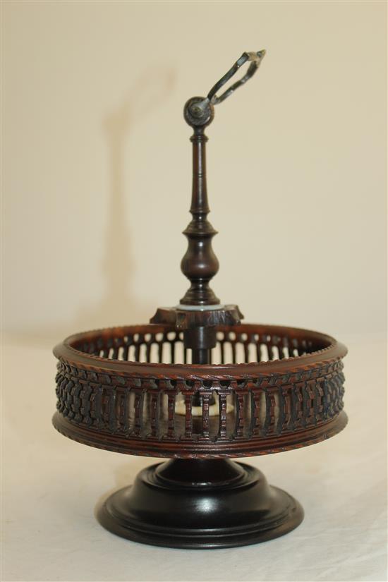 A Georgian style brass mounted turned and pierced lignum vitae cruet stand, H.9.5in.